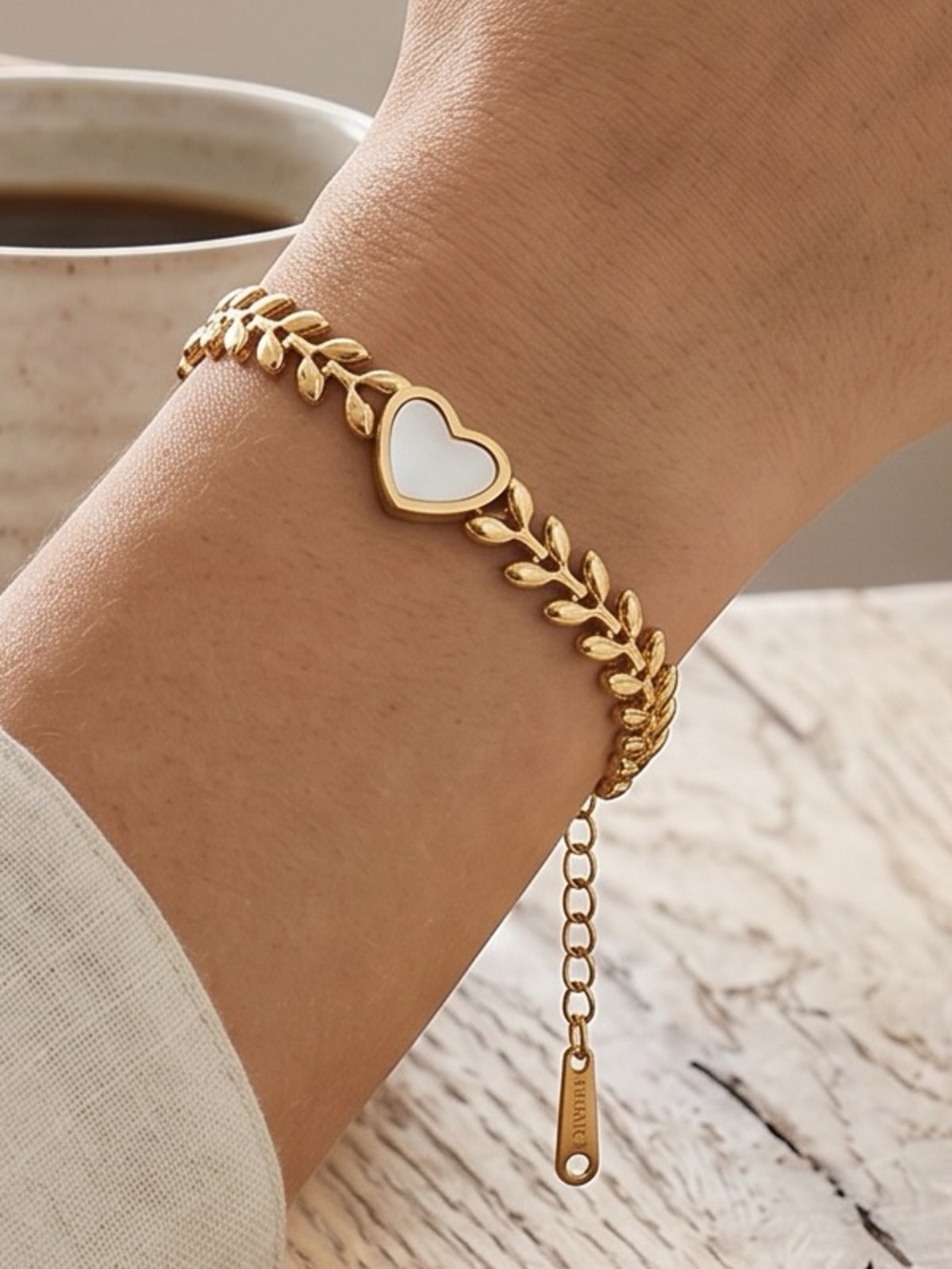 Gold Heart-Link Bracelet with White Enamel Center